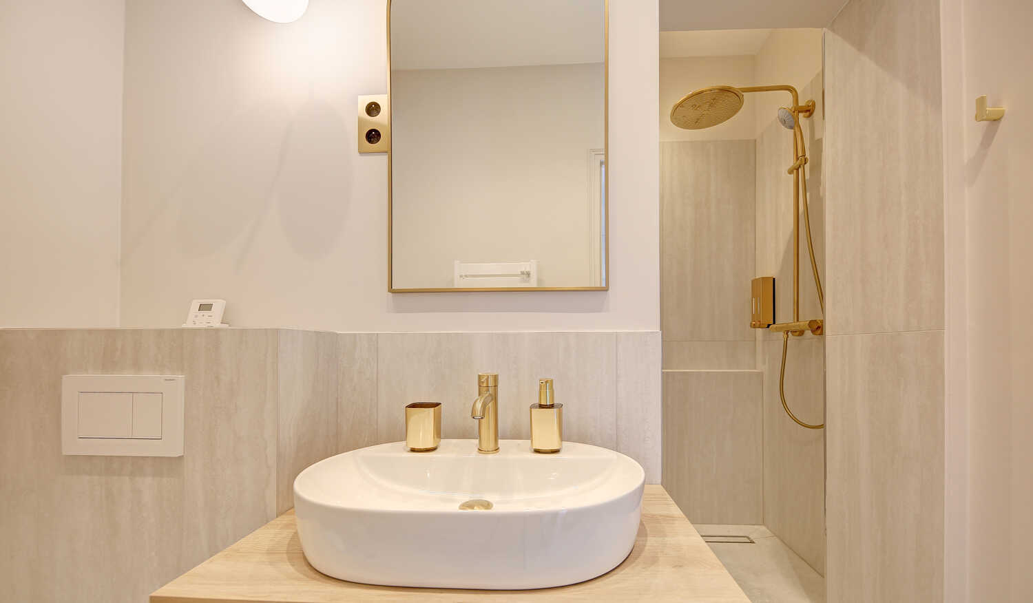 Elegant bathroom with vessel sink and gold accents