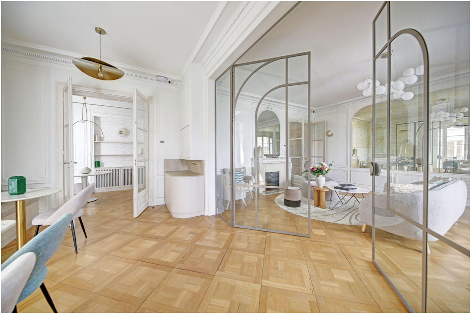 Dining space with plush banquettes and brass pendant lights