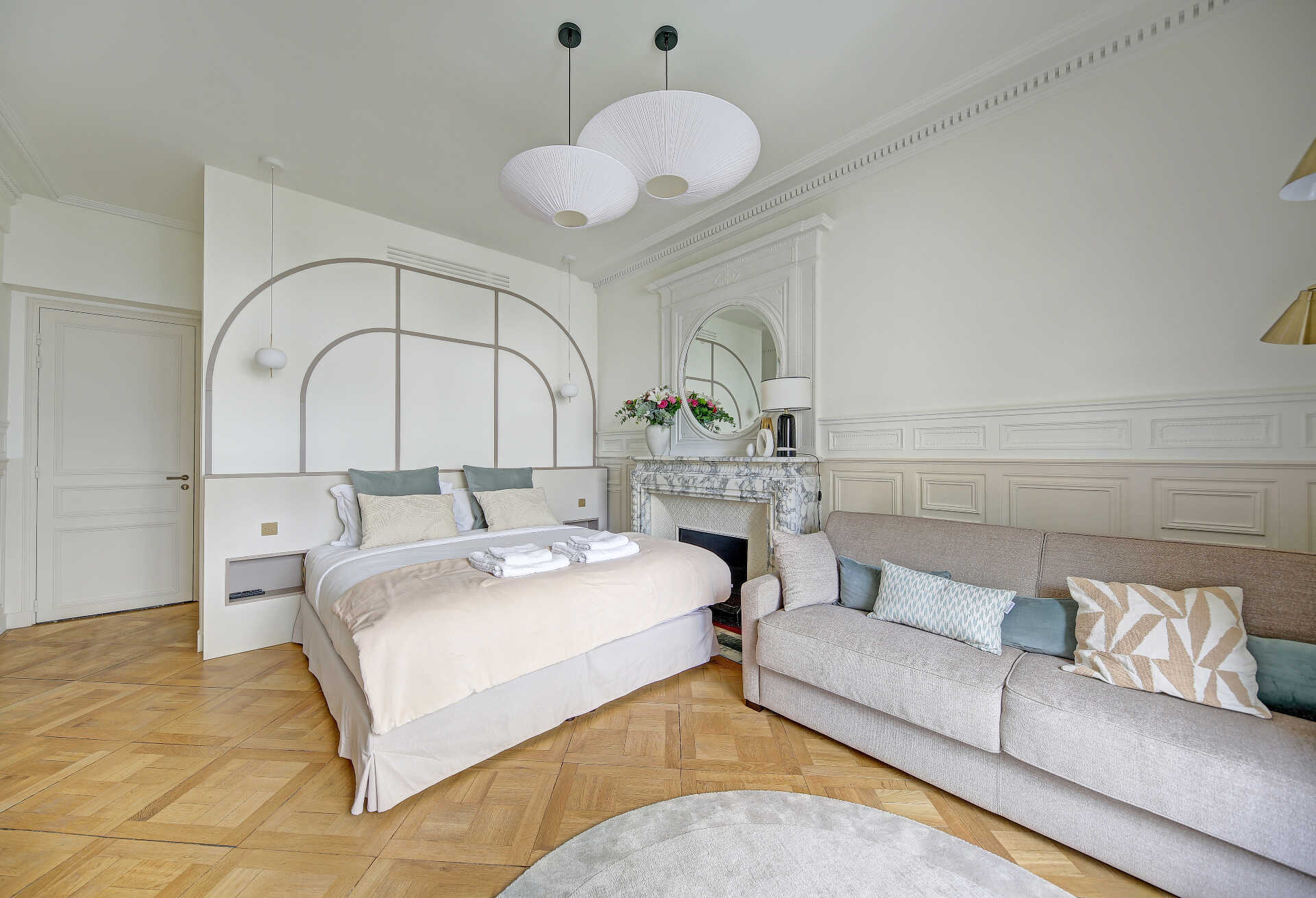 Elegant bedroom with Art Deco design and herringbone parquet flooring