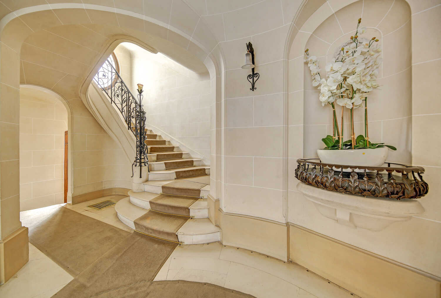 Elegant staircase with wrought iron balustrade